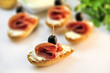 Photo: croutons with sliced salami cheese and olives croutons with sliced salami cheese and olives