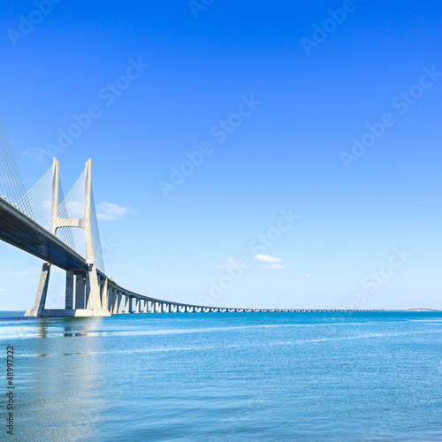 Photo: Vasco da Gama bridge on Tagus River. Lisbon, Portugal, Europe. Vasco da Gama bridge on Tagus River. Lisbon, Portugal, Europe.