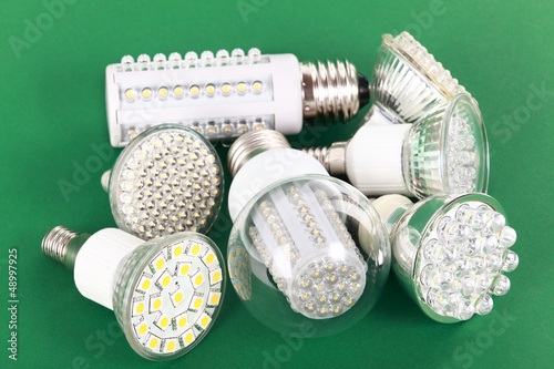 Photo: Newest LED light bulb on green Newest LED light bulb on green