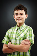 Photo: Young boy with his arms folded Young boy with his arms folded
