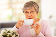 senior woman drinking tea at home