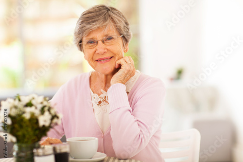 Photo: elegant senior woman having tea elegant senior woman having tea