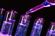test-tubes with liquid on black background