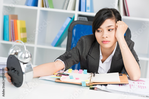 Photo: Overworked businesswoman Overworked businesswoman