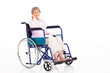 elegant senior woman sitting on wheelchair isolated on white
