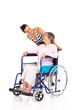caring daughter talking to disabled senior mother