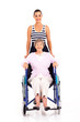 granddaughter pushing disabled senior grandmother on wheelchair