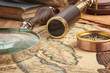 Photo: Brass telescope on map Brass telescope on map