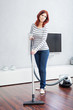Attractive Female with Vacuum Cleaner