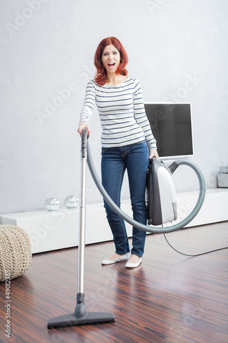 Photo: Attractive Female with Vacuum Cleaner Attractive Female with Vacuum Cleaner