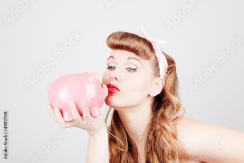 Photo: woman with piggy bank woman with piggy bank