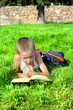 Little Boy Reads Book