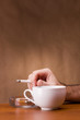 Photo: Hand holding a cigarette Hand holding a cigarette