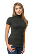 Young carefree female standing with hands in pockets