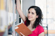 Potrait of a college student in a library