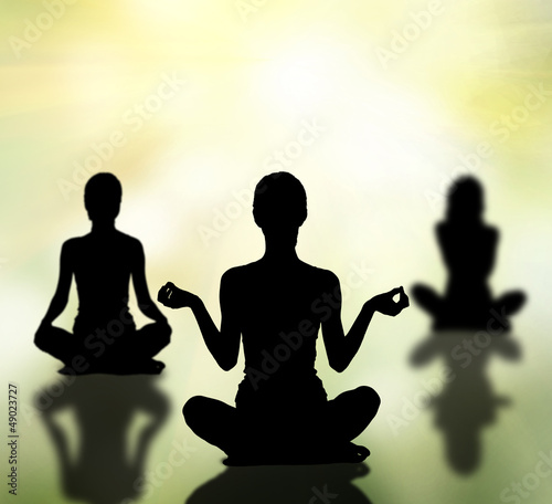 Illustration: silhouettes of women practicing yoga lotus pose silhouettes of women practicing yoga lotus pose