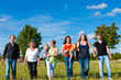 Family and multi-generation - fun on meadow in summer