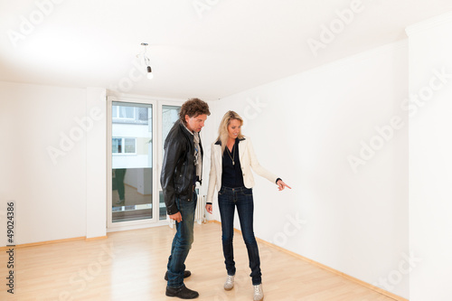 Photo: Young couple looking for real estate Young couple looking for real estate