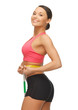 woman measuring her waist