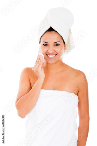 Photo: Woman cleaning her face Woman cleaning her face