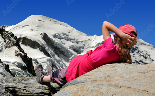 Photo: girl looking at the Mont Blanc in the Savoy Alps - France girl looking at the Mont Blanc in the Savoy Alps - France