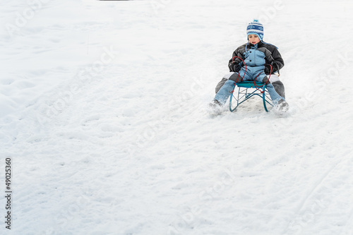 Photo: Little boy on sleigh Little boy on sleigh