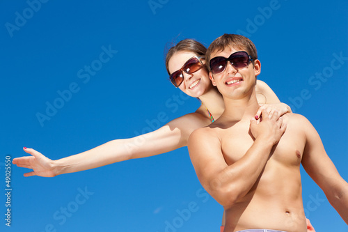 Photo: Happy Young Couple Together On The Beach Happy Young Couple Together On The Beach