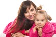 Happy mother and daughter in dressing gowns