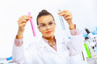 Photo: Young female scientist working in laboratory Young female scientist working in laboratory