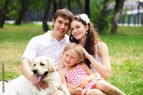 Photo: Happy family having fun outdoors Happy family having fun outdoors