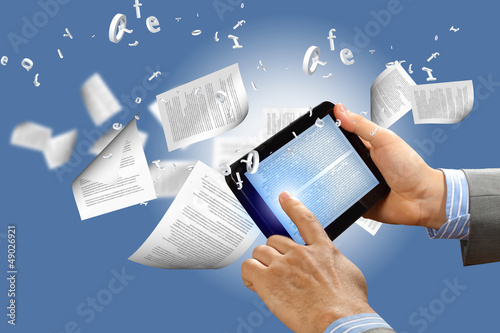 Photo: e book reader and books e book reader and books