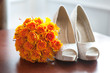 Photo: wedding shoes and bouquet of orange roses wedding shoes and bouquet of orange roses