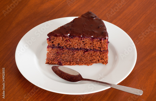 Photo: Tasty chocolate sacher cake close up Tasty chocolate sacher cake close up