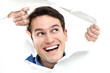 Man peeping through hole on paper