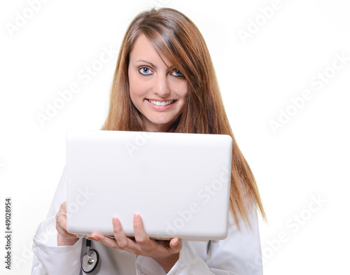 Photo: cute female octor working with notebook cute female octor working with notebook