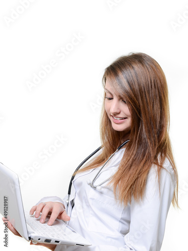 Photo: cute female doctor working with notebook cute female doctor working with notebook