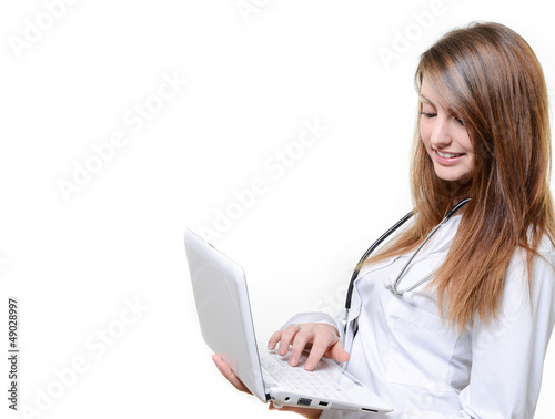 Photo: attractive female doctor working with notebook attractive female doctor working with notebook