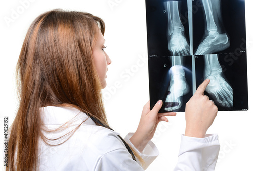 Photo: female doctor looking at X-ray image female doctor looking at X-ray image