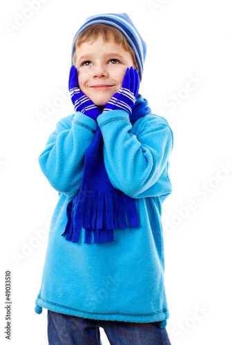 Photo: Thoughtful boy in winter clothes Thoughtful boy in winter clothes
