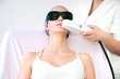 Young woman receiving epilation laser treatment