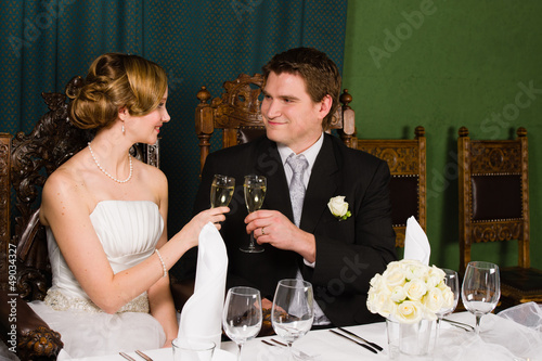 Photo: Bride and groom toasting Bride and groom toasting