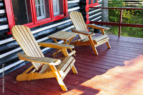 Photo: Log cabin porch with chairs Log cabin porch with chairs