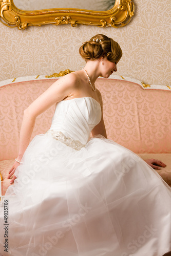 Photo: Bride and pink couch Bride and pink couch