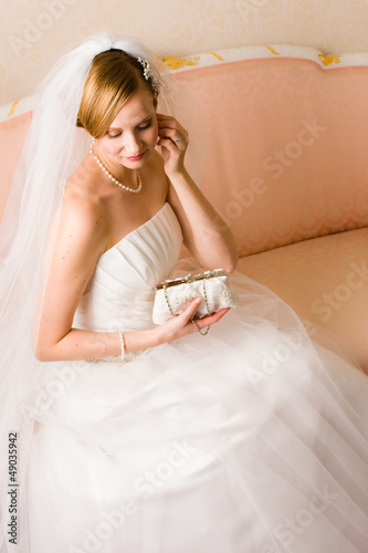 Photo: Bride and purse Bride and purse