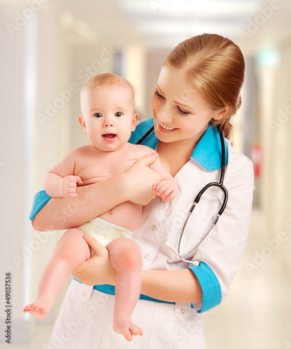 Photo: Pediatrician woman doctor holding baby Pediatrician woman doctor holding baby