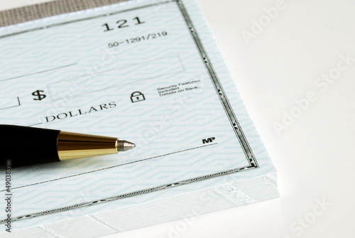 Photo: Write the dollar amount on the check Write the dollar amount on the check