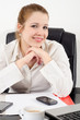 Portrait of beautiful business woman sitting in her office