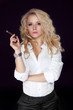 Photo: Woman with Cigar Exhaling Smoke on a Dark Background, Men style Woman with Cigar Exhaling Smoke on a Dark Background, Men style