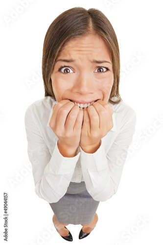 Photo: Frightened and stressed young business woman Frightened and stressed young business woman