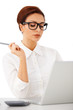 Elegant businesswoman reading her laptop